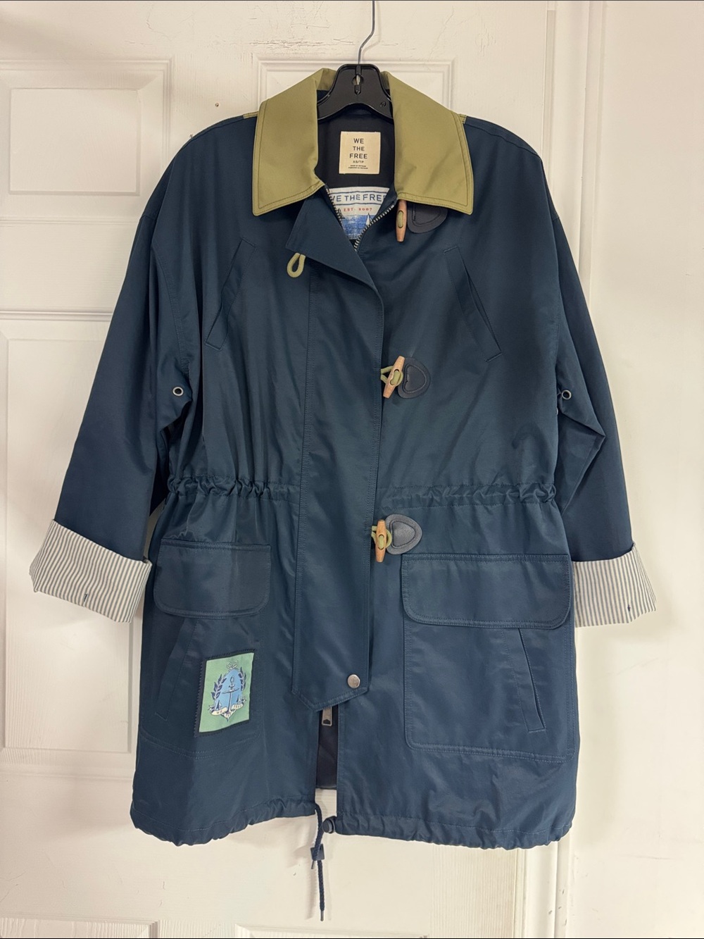 We The Free Navy Rain Jacket with Olive Collar and Striped Cuffs